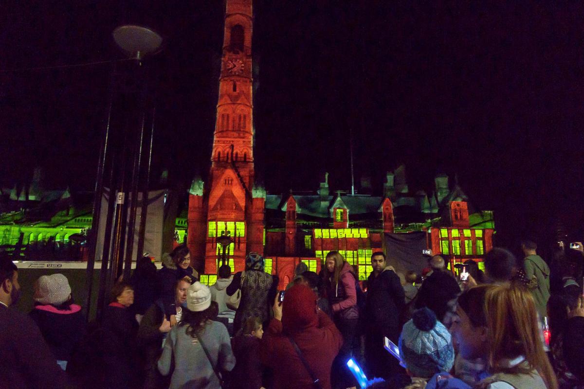 Crowds stand in admiration outside City Hall during the Illuminate Bradford weekend