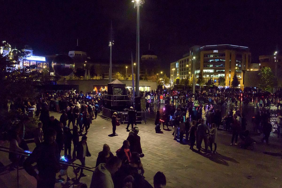 Crowds stand in admiration outside City Hall during the Illuminate Bradford weekend