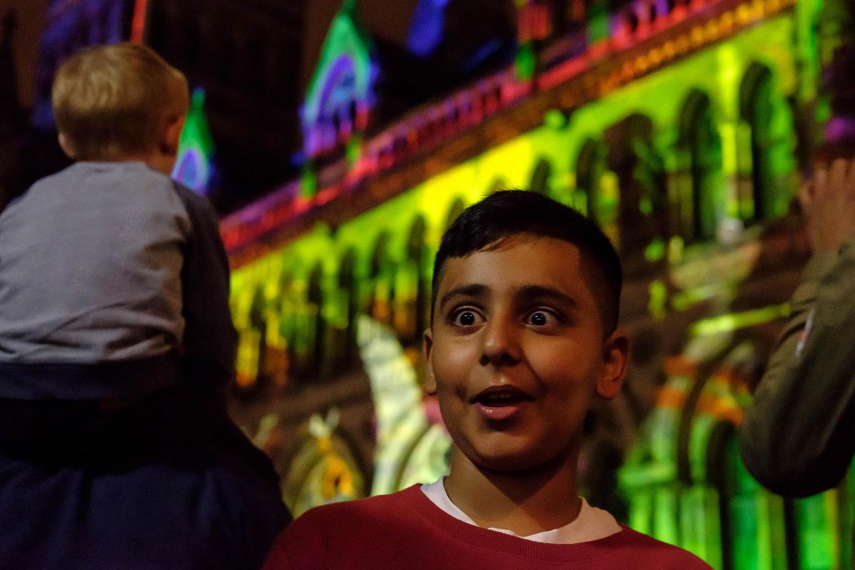 Faris Bashir, 9, is amazed by the lightshow outside City Hall