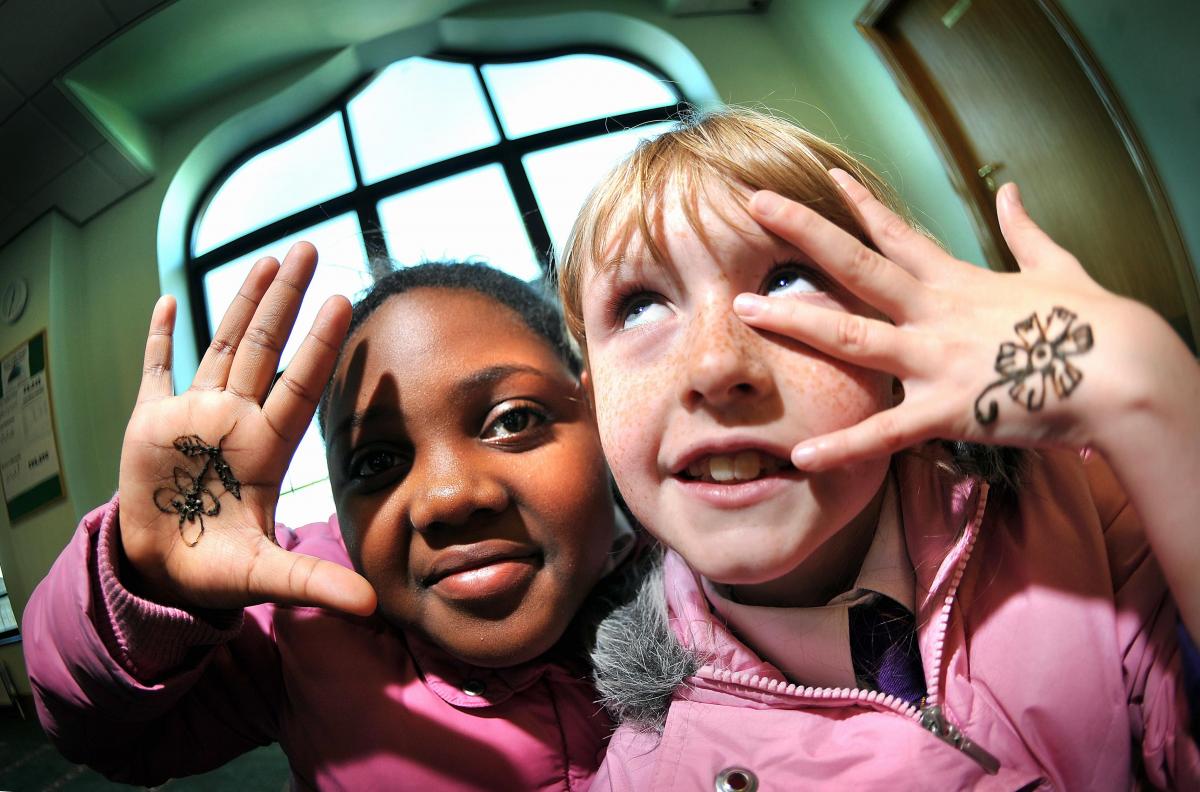 Wibsey Primary pupils Keisha Robinson, left, and Jordenne Birch, both eight, with henna designs