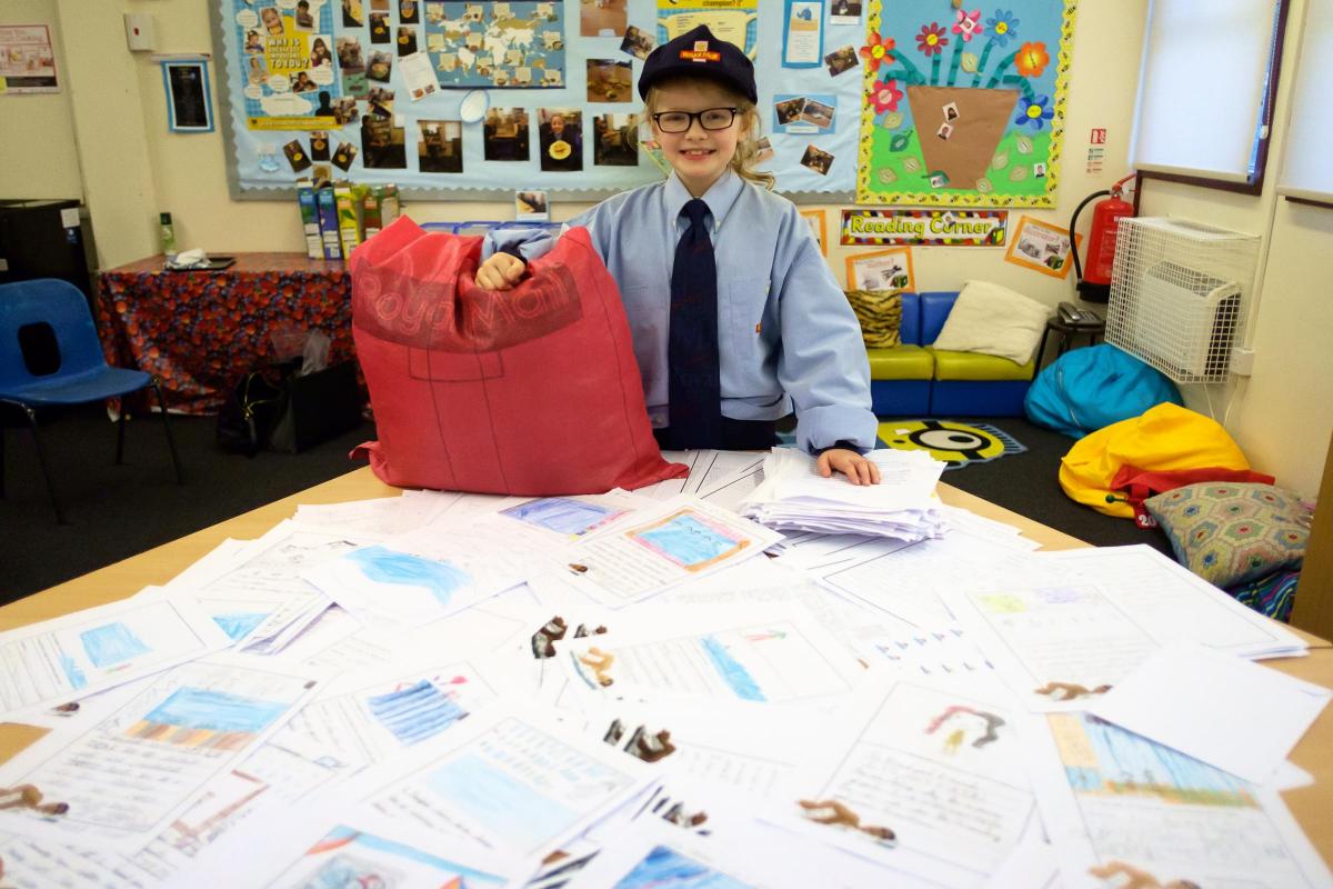JANUARY Russell Hall School year 5 student Brooke Carroll with hundreds of letters which had been sent to Russell Hall School in a bid to save Queensbury's Pool