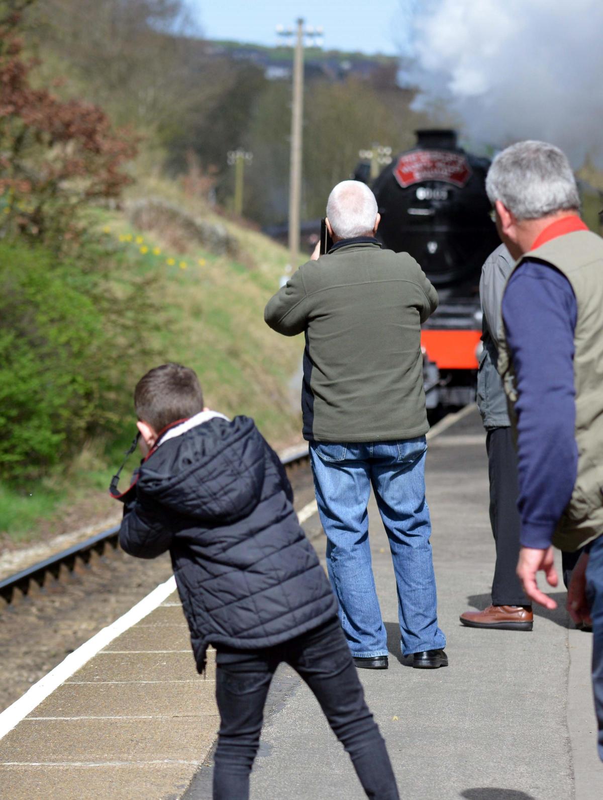 APRIL People watch wait and take pictures of the Flying Scotsman locomotive on the visit to the Keighley worth Valley line
