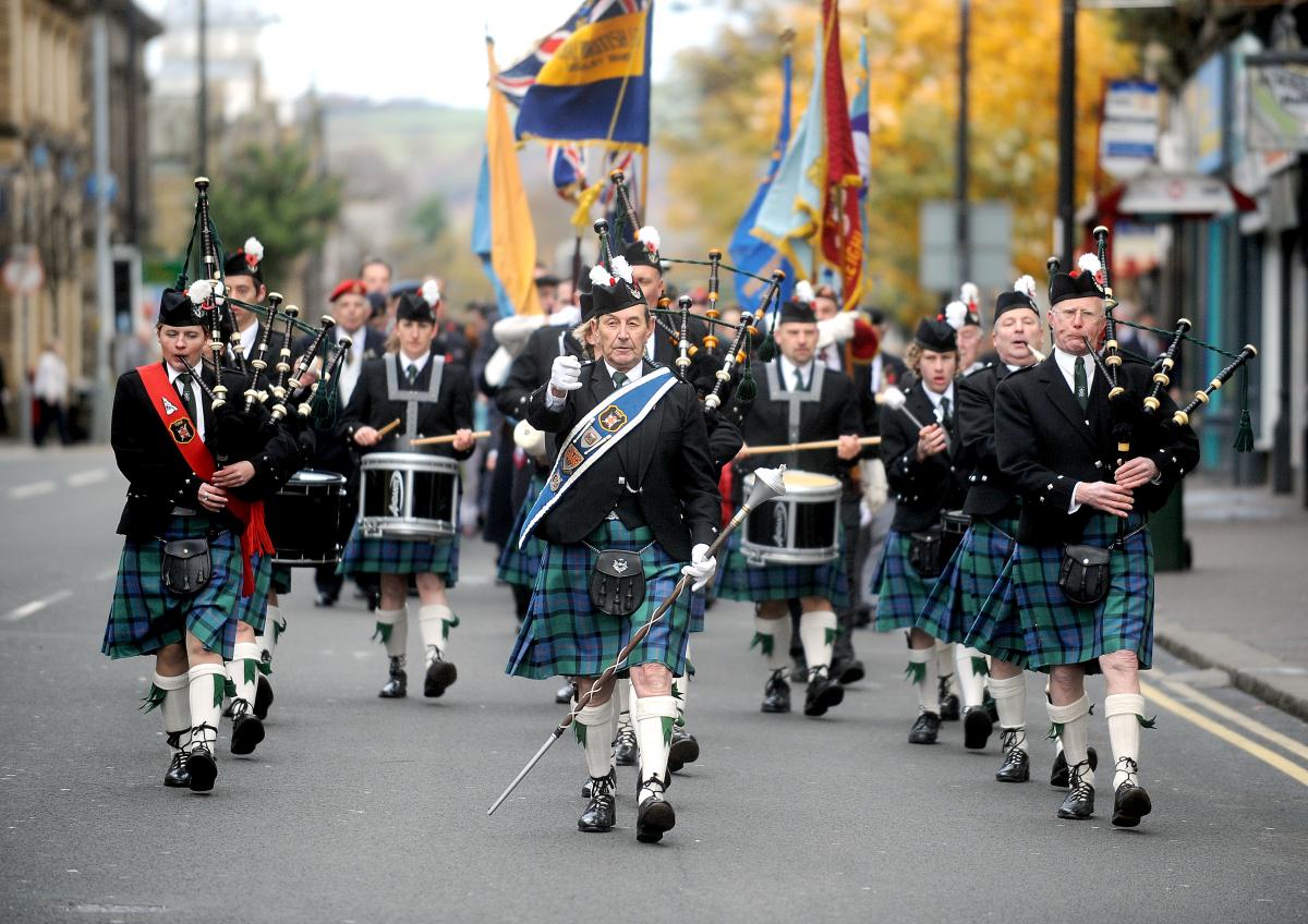 A pipe band leads the Remembrance Day parade at Keighley