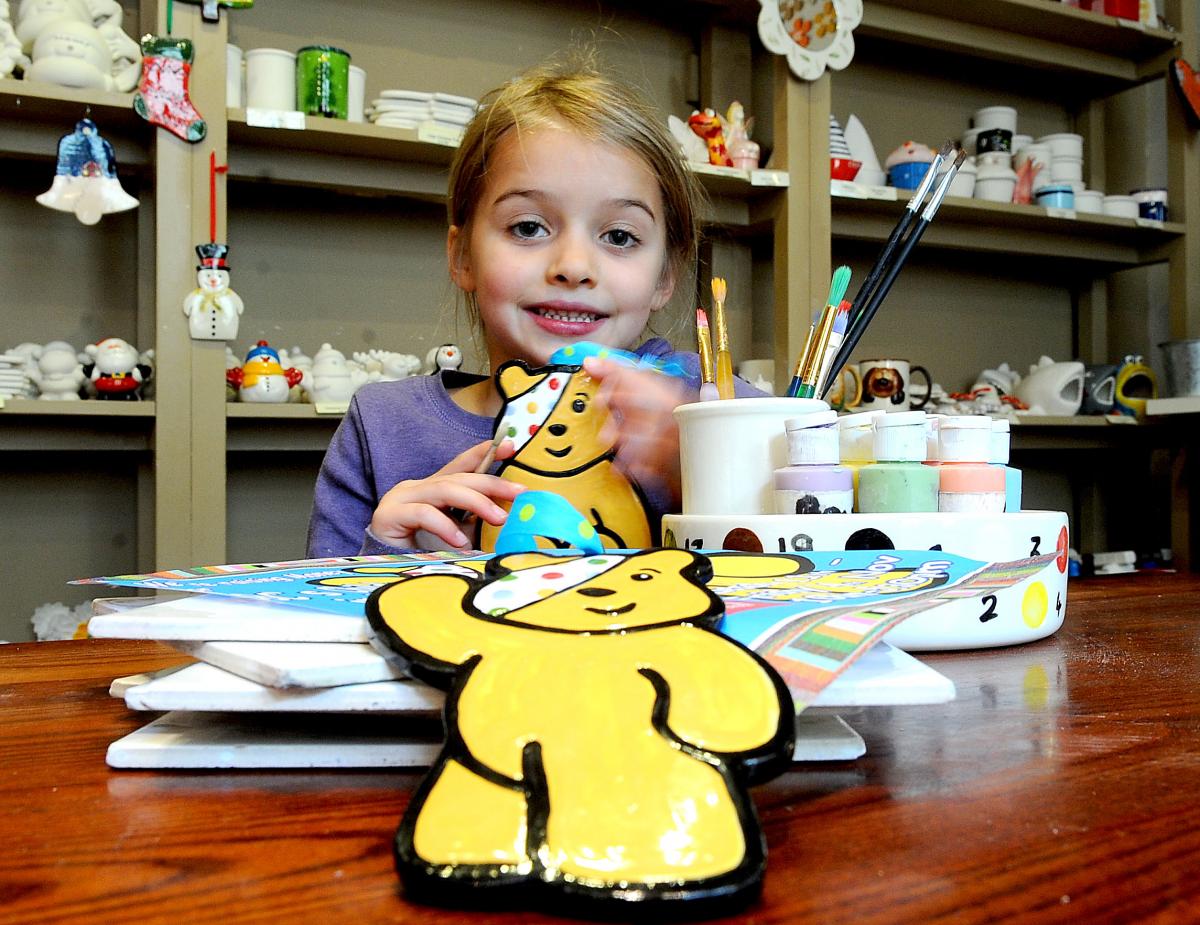 The Create Pottery Cafe in Ilkley has been inviting parents and children to go along and paint ceramic Pudsey Bears to raise funds for Children in Need. Lucy Allen, six, is pictured with her bear