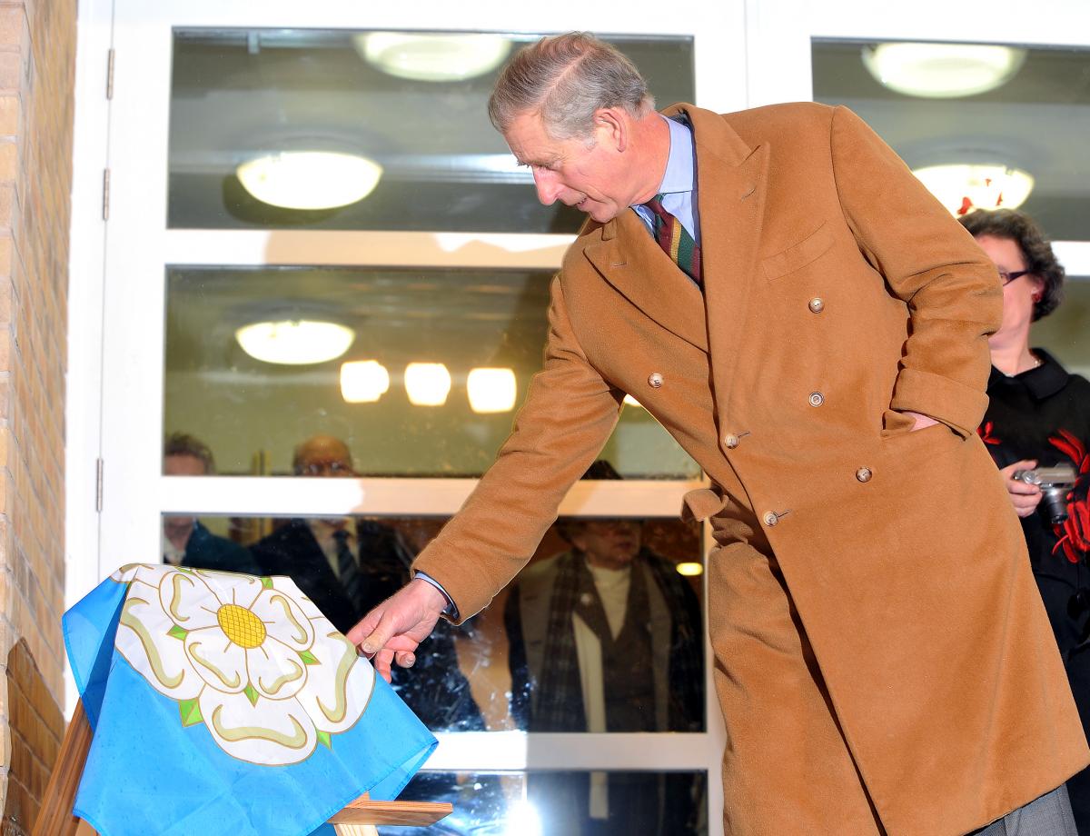 Prince Charles unveils a plaque to officially open the Cornerstone Project at Cottingley