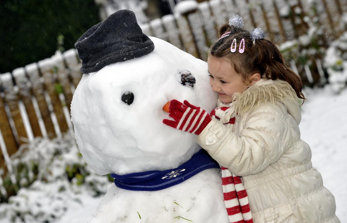 Louise Messenger puts the finishing touches to her snowman