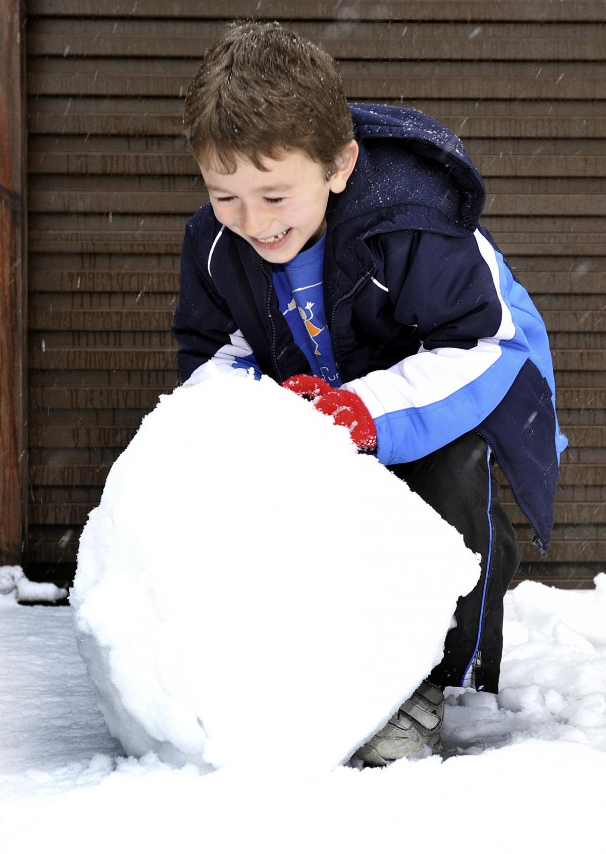 Aiden Messenger having fun with a snowball