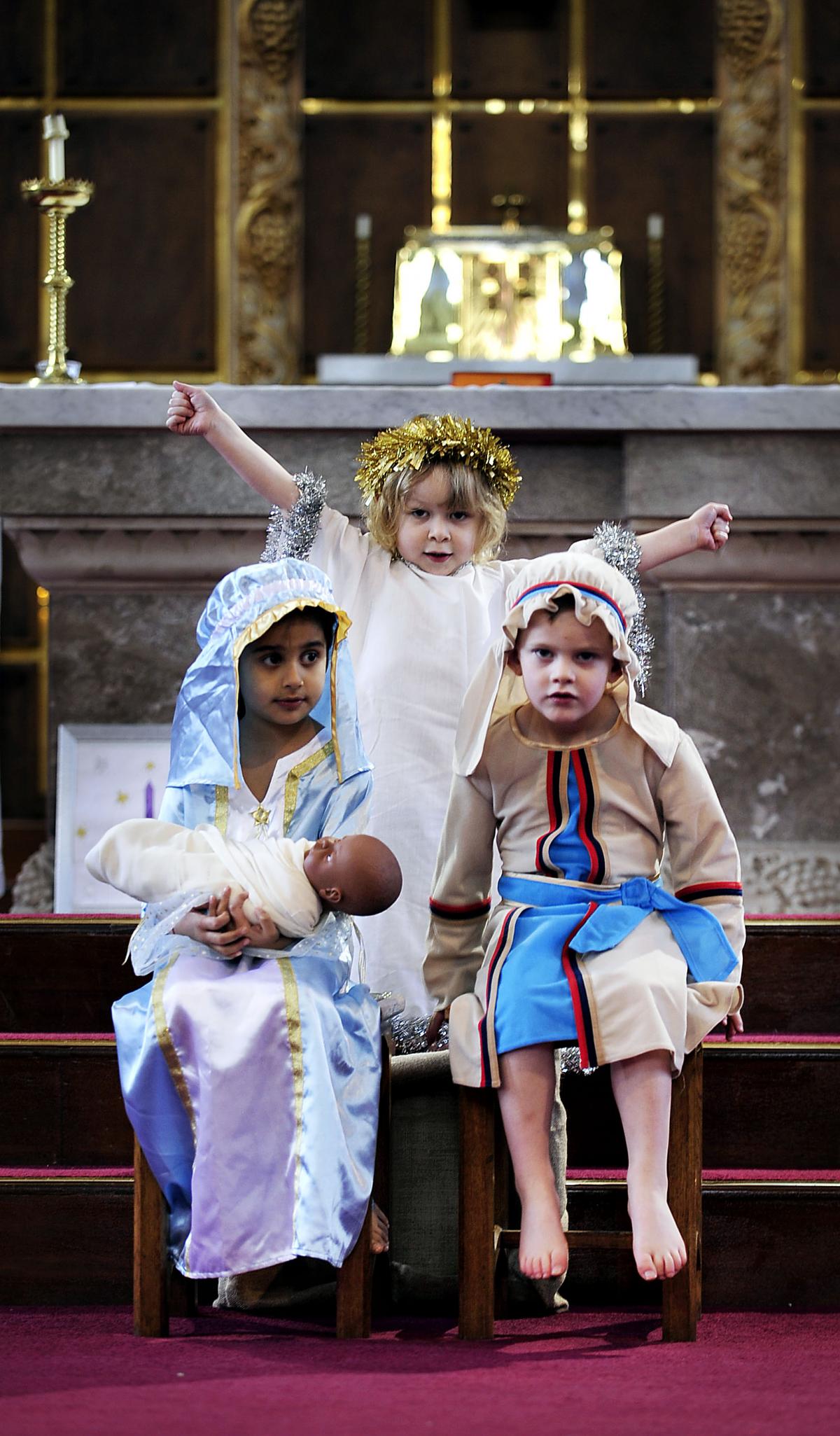 Taking part in St Clare's Catholic Primary School Nativity are, from the left, Alyssa Koshal-Mahmood, Dante Kelly and Daniel Liddemore