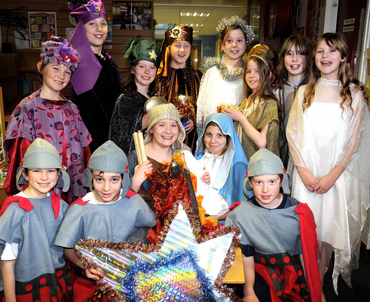 The cast o St Oswald's CE Primary School Nativity with Chloe Wager and Annabel Tate as Mary and Joseph
