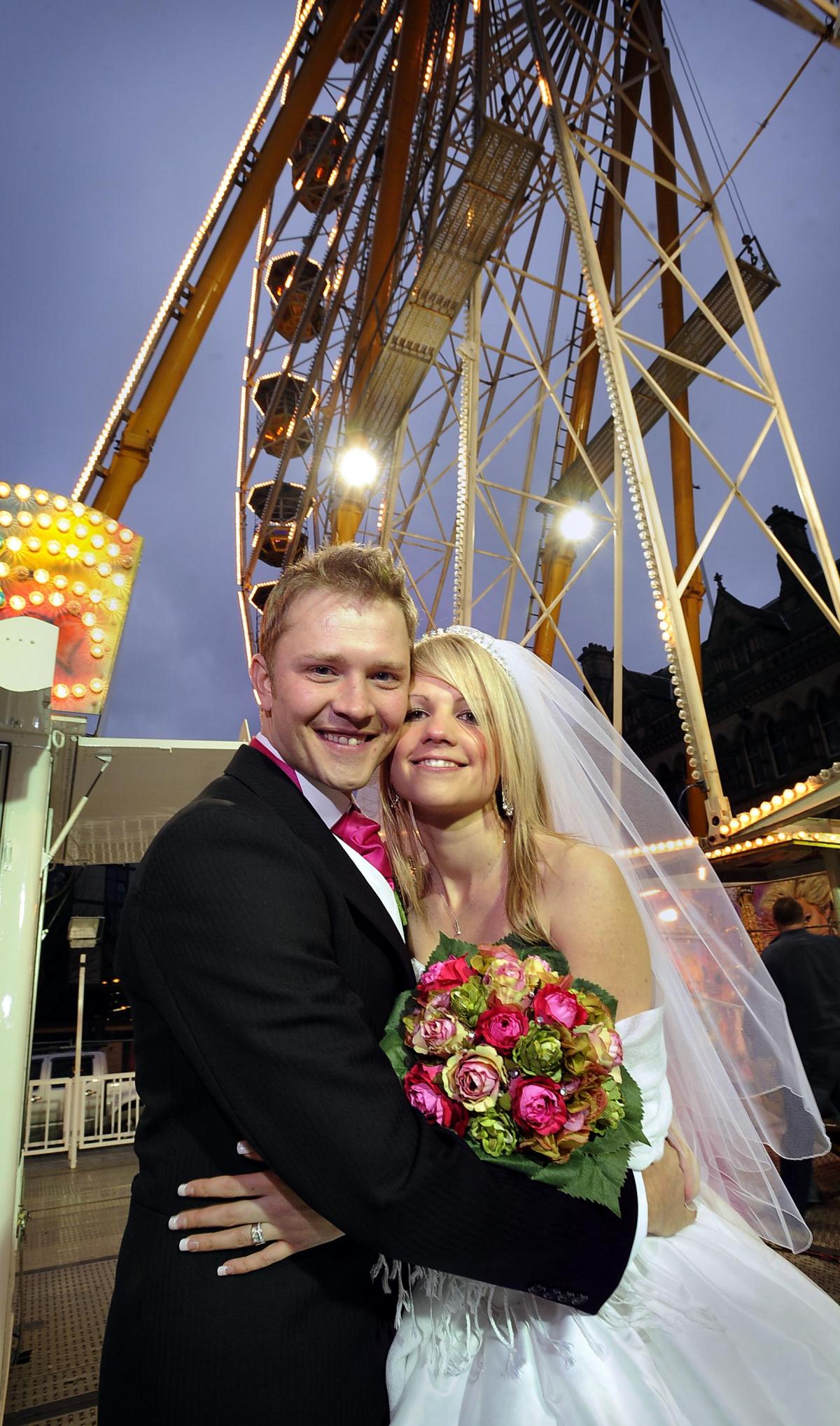 Martyn and Kelly Lewis in front of the big wheel in Centenary Square