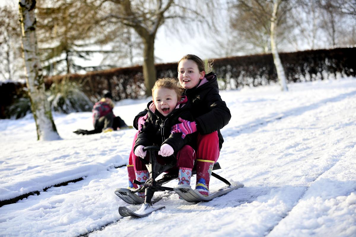 Niamh and Rhiain Osborne-Parkin sledging in Northcliffe Park, Shipley.