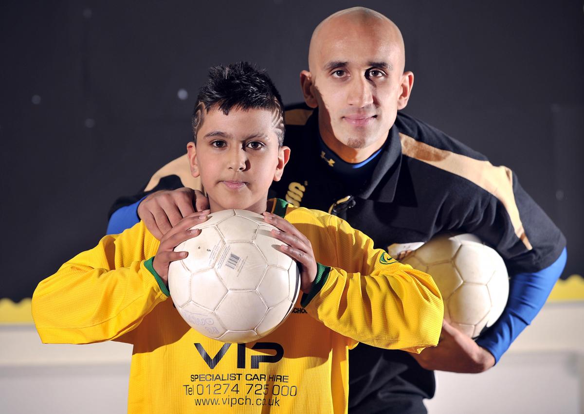 The goalscoring exploits of a young Bradford footballer have earned him recognition among Britain’s finest Asian sportsmen. Hanif is pictured with Pakistan international and Bradford City player Zesh Rehman.