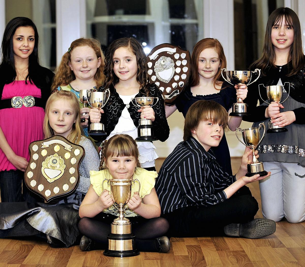 These youngsters at Bradford's Stage 84 have won armfuls of trophies from a performing arts festival. 