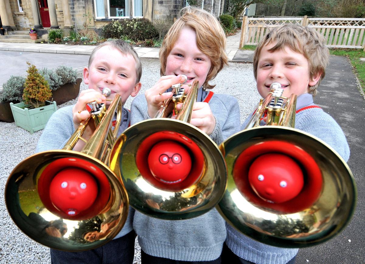 Members of Ghyll Royd School Band tune up for Red Nose Day. They will be playing in the Grove bandstand at Ilkley. Pictured, from the left, are Benjamin Langfield, 9, Thomas Atkinson, 9, and Joshua Dracup, 10.