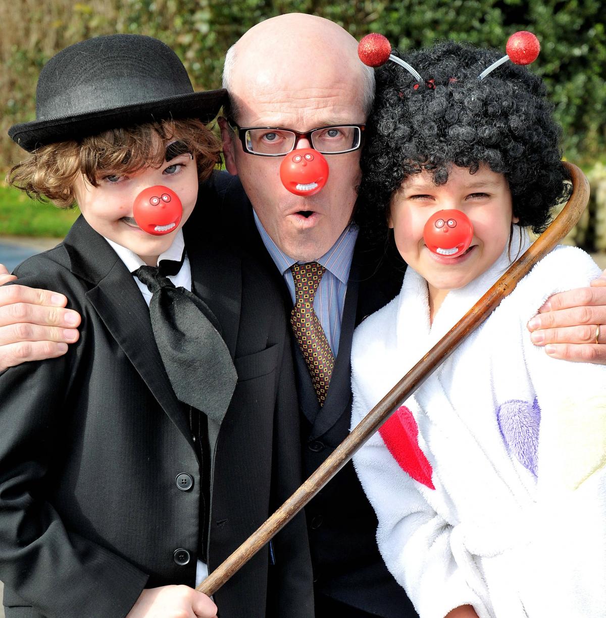 Getting ready for Red Nose Day at Westville House School, Ilkley are head teacher Charles Hollaway with Ben Wood and Aimee Lindsay, both age 9.