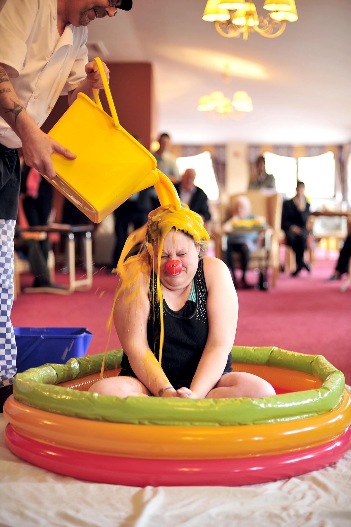 Covering herself in custard for Red Nose Day is Rachel Parkinson, a care worker at Ashcroft Nursing Home at Undercliffe.