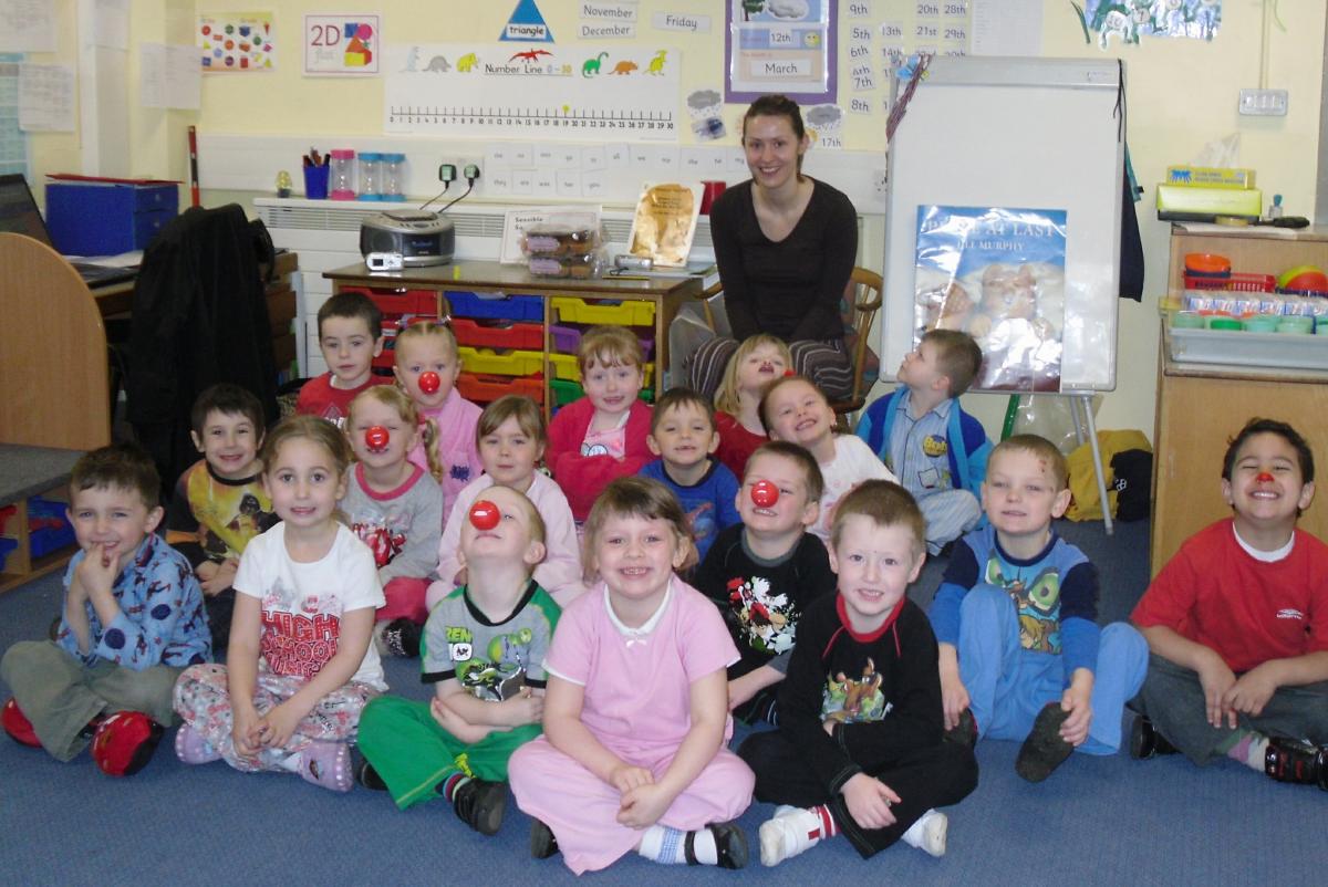The Reception Class at Windhill C of E Primary School are pictured with their teacher.  Year 6 children are taking things a bit literally by dozing off in class and the whole school is singing the Comic Relief song at Good News Assembly.
