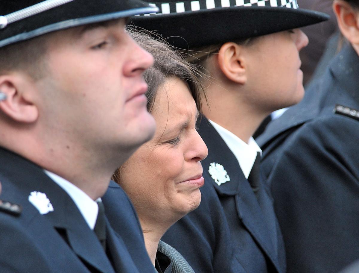 PC Beshenivsky's colleague PC Teresa Milburn, who was shot in the same incident tries to hold back the tears.