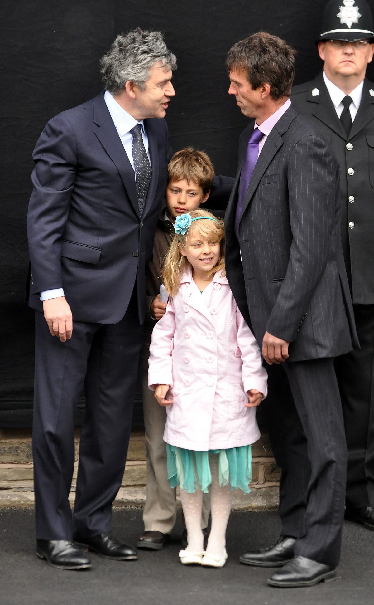 Prime Minister Gordon Brown with Paul Beshenivsky and his children Lydia and Paul.