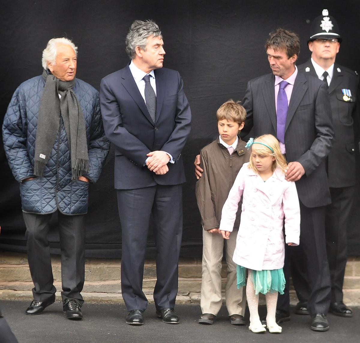 Prime Minister Gordon Brown and Michael winner with Paul Beshenivsky and his children Lydia and Paul.