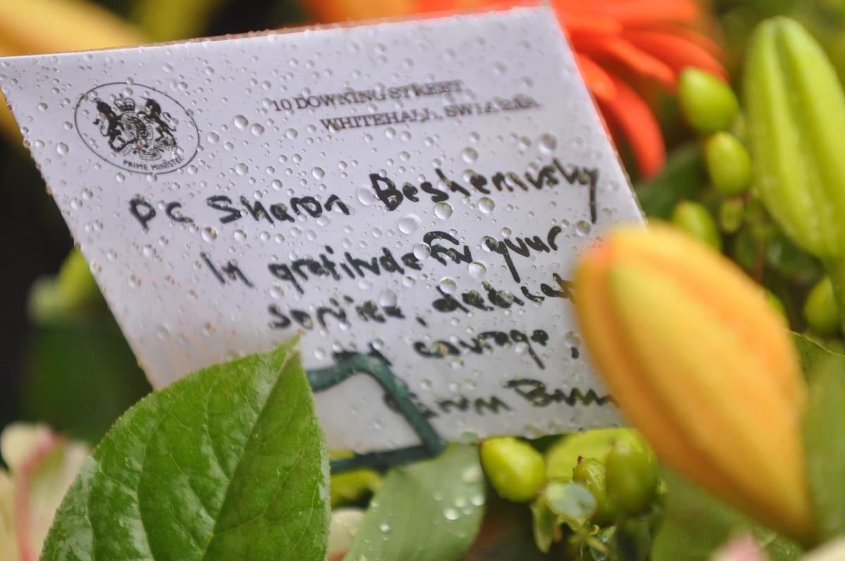Floral tributes laid at the memorial.
