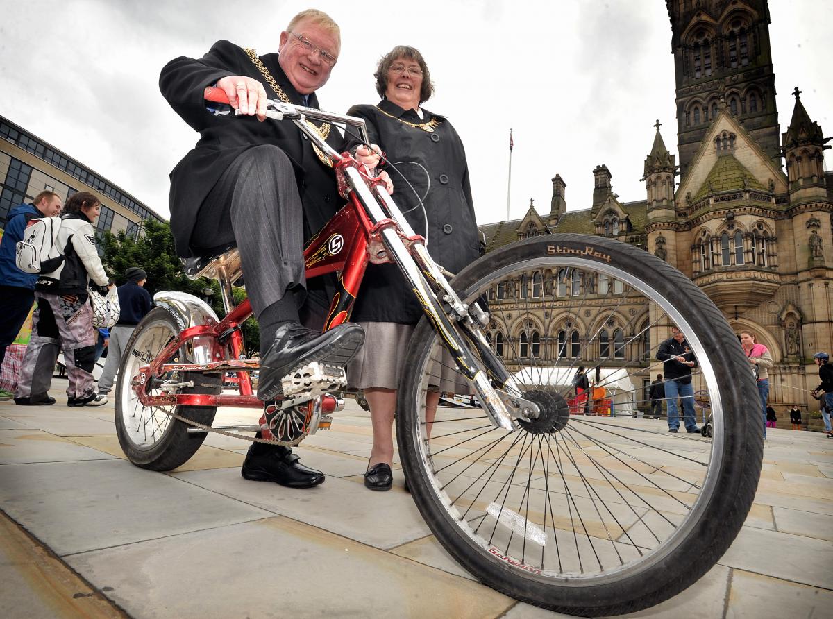 Mayor of Bradford Councillor John Godward tries out a fun bike at the Big City Play Day in Centenary Square, Bradford