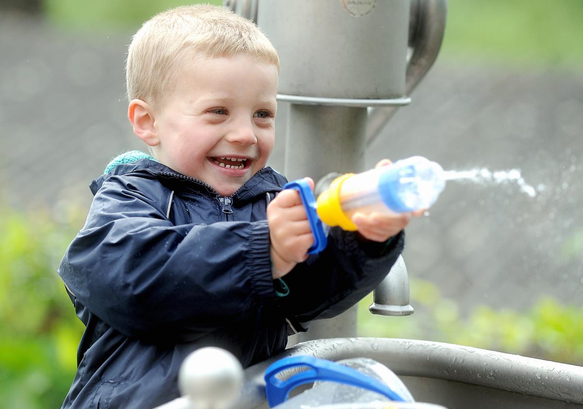 Tom Ridley has fun with a water pistol at the family fun day at the Nell Bank centre in Ilkley