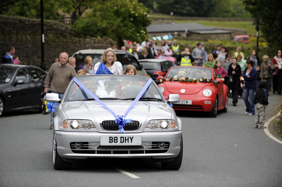 The gala queen’s car leads the parade at Laycock Gala