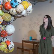 Curator Angela Sheard with one of the exhibits at the Our Plastic Ocean exhibition at Impressions Gallery