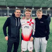 Lewis Hey (middle) wearing the England shirt at St George's Park