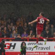 Will Wright jumps for joy after scoring Crawley's winner