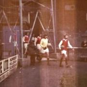 Mick Fleming leads Avenue out on to the field for their last game before liquidation in 1974.