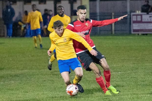 Matthias Britton (right), pictured playing against Albion for Silsden back in 2019, is now a key striker for the men in yellow, and he got their winning goal on Saturday at Bottesford. Pic: David Brett.