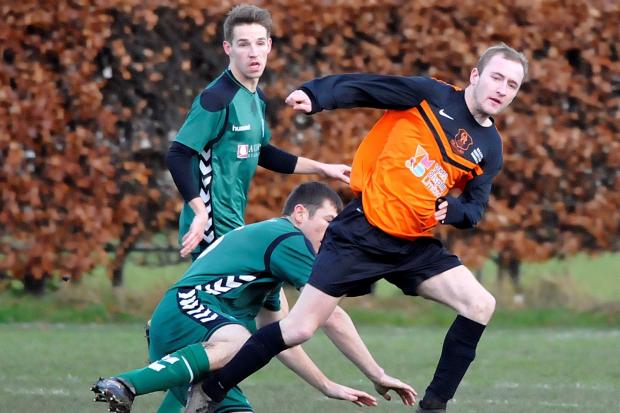 Tom Marshall, playing here for Oxenhope (in orange) against Steeton, died 18 months ago at the age of just 25. Picture: Richard Leach.