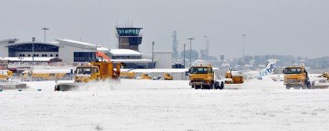 Snow ploughs battle to clear the runway at Leeds-Bradford International Airport.