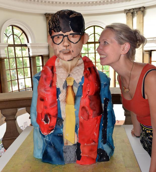 Bradford Telegraph and Argus: Kirsty Young with a Hockney birthday cake ahead of his 80th celebrations in Lister Park in 2017