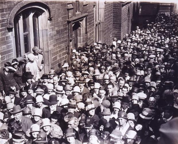 Bradford Telegraph and Argus: Crowds queue at Bronte Parsonage Museum when it opened in the 1920s 