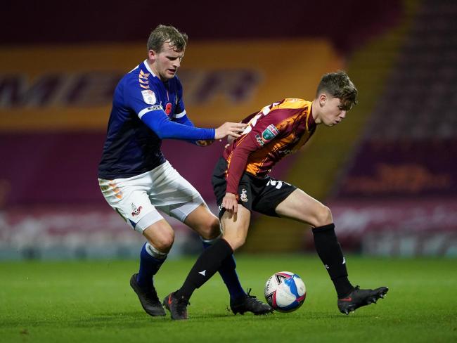 Danny Rowe challenges City youngster Charlie Wood in the Papa John's Trophy at Valley Parade. Picture: Zac Goodwin/PA Wire
