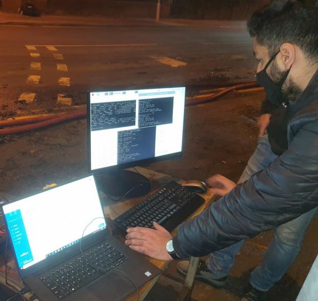 Bradford Telegraph and Argus: Data scientists from the University of Bradford with air quality testing equipment at the scene of the fire