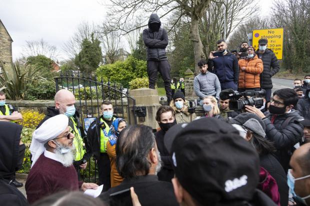 Bradford Telegraph and Argus: Protesters at the school gates of Batley Grammar, where a cartoon of Muhammad was used in a religious studies lesson