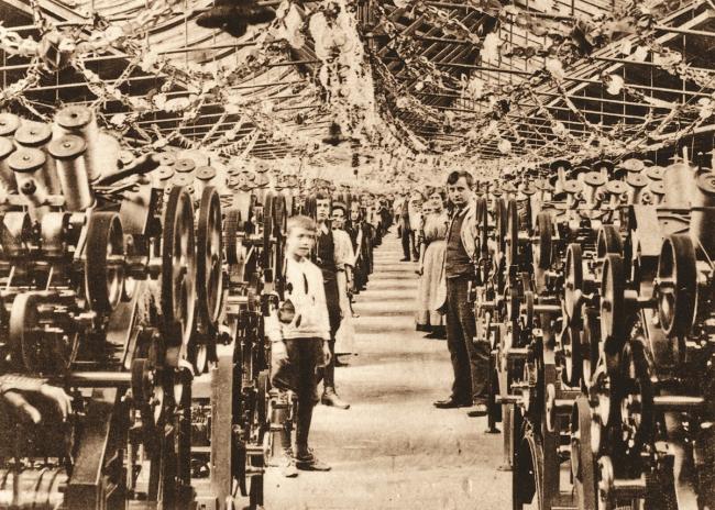 A boy worker in spinning department at Lister’s Mill, 1902