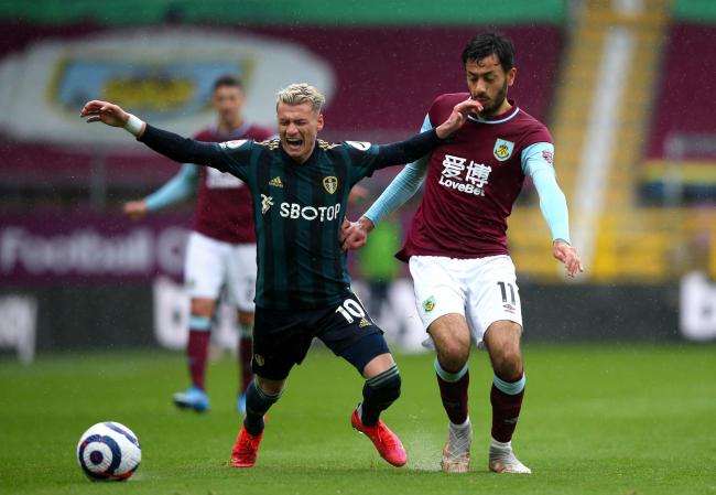 Leeds United's Gjanni (Ezgjan) Alioski (left) and Burnley's Dwight McNeil (right) battle for the ball during the Premier League match at Turf Moor, Burnley on May 15. Pic: PA Wire/PA Images