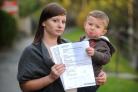 Lisa-Marie Holmes, with her two-year-old son Bradley, who has hit out over the tax decision
