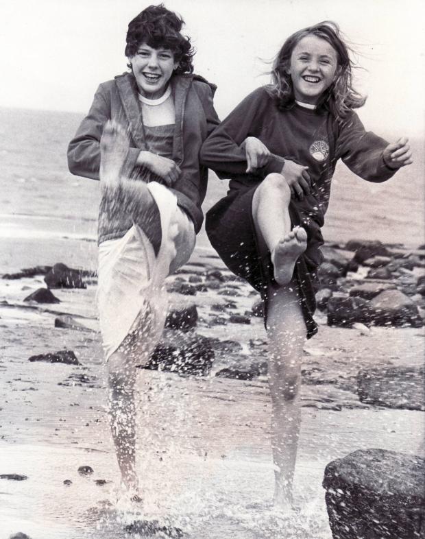 Bradford Telegraph and Argus: Youngsters on Morecambe beach on a playscheme day out in 1982
