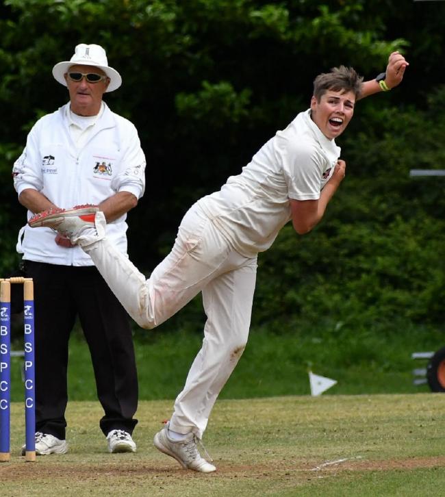 An umpire standing behind leg-spinner James Massheder in a Bradford League encounter. Picture: Richard Leach.