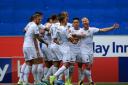 Leeds United's Adam Forshaw, right, celebrates with his team-mates after he scores his side's first goal during their Skybet Championship victory over Wigan Athletic at the DW Stadium