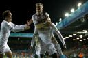 Eddie Nketiah is mobbed by his Leeds United team-mates after scoring the winner against Brentford