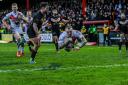 Matty Dawson-Jones goes over in flamboyant fashion for one of his two tries against London   Picture: Tom Pearson