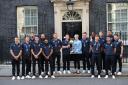 The England team celebrate their World Cup final win with former Prime Minister Theresa May last July - all fully kitted out by none other than Crossflatts' latest signing Joe Hicks Picture: Yui Mok/PA Wire