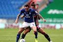 Cardiff City's Lee Tomlin and Leeds United's Kalvin Phillips during the Sky Bet Championship match at Cardiff City Stadium